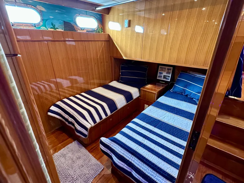 Slide: The Image of Twin cabin with striped bedding in 2002 Jefferson Marquessa 57 MY yacht. - 24