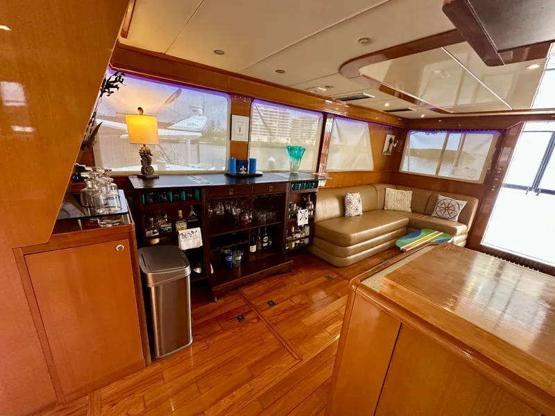 Slide: The Image of Luxurious interior of 2002 Jefferson Marquessa 57 MY yacht with elegant seating and bar area. - 31