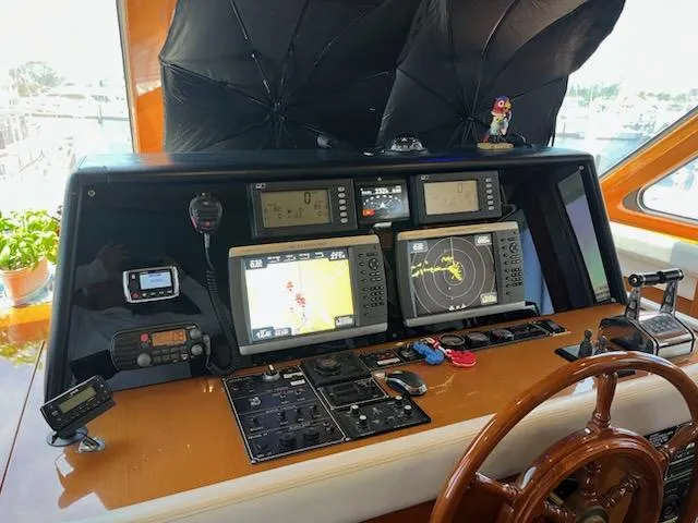 Slide: The Image of Pilothouse of 2002 Jefferson Marquessa 57 MY with navigation equipment and wooden steering wheel. - 34