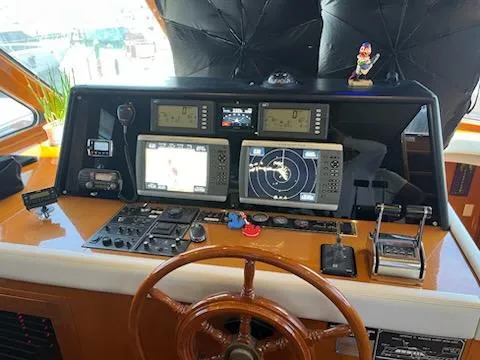 Slide: The Image of Helm of 2002 Jefferson Marquessa 57 MY with navigation equipment and wooden steering wheel. - 35