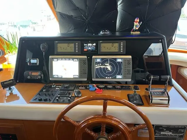 Slide: The Image of Helm of 2002 Jefferson Marquessa 57 MY with navigation equipment and wooden steering wheel. - 36
