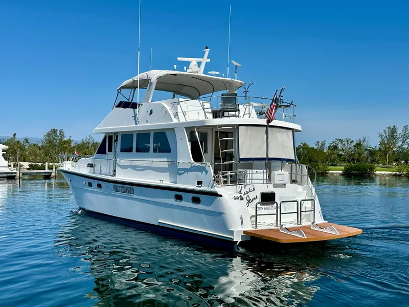 Slide: The Image of 2002 Jefferson Marquessa 57 MY yacht on calm water, clear sky background. - 5