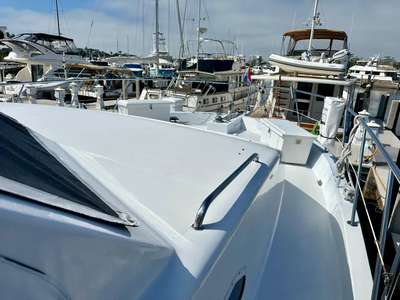 Slide: The Image of 2002 Jefferson Marquessa 57 MY yacht docked among other boats in a marina. - 9