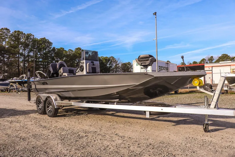 The Image of 2026 Excel 220 Bay Pro Elite boat on trailer, parked outdoors under clear sky. - 0