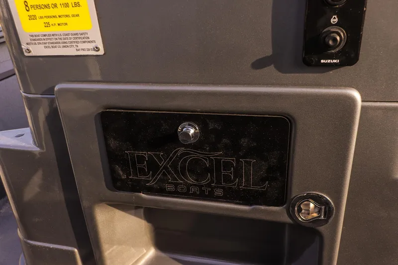 Slide: The Image of Close-up of Excel 220 Bay Pro Elite boat details, showcasing logo and capacity label. - 10