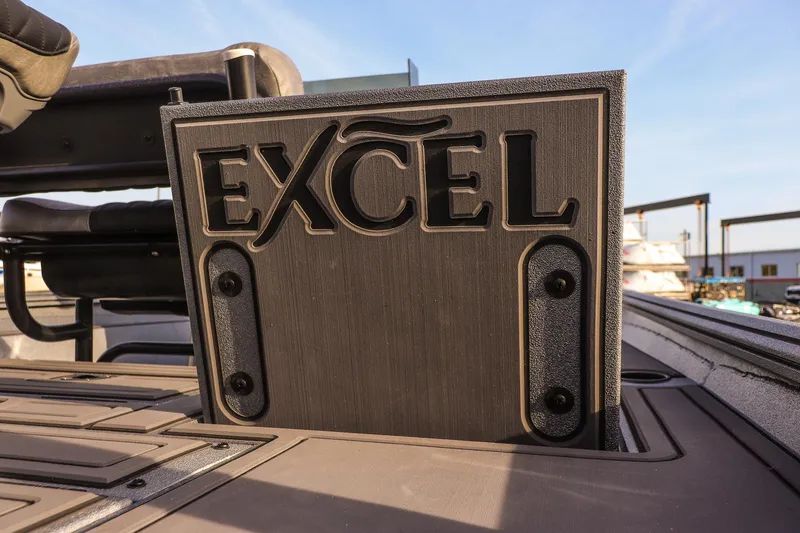 Slide: The Image of 2026 Excel 220 Bay Pro Elite boat interior with logo detail. - 14