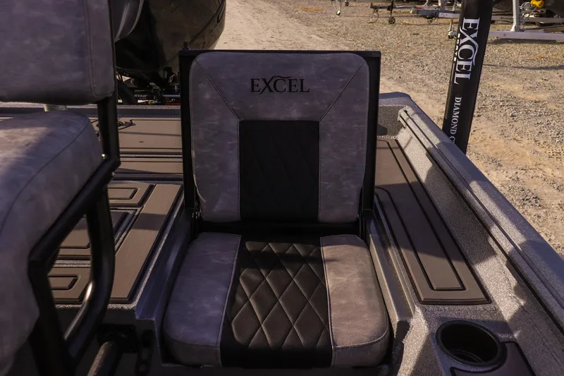 Slide: The Image of 2026 Excel 220 Bay Pro Elite boat seat with logo, featuring diamond pattern upholstery. - 18