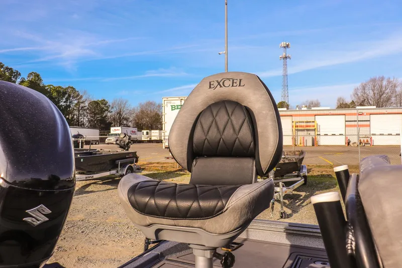Slide: The Image of 2026 Excel 220 Bay Pro Elite boat seat, outdoor setting, clear sky background. - 25