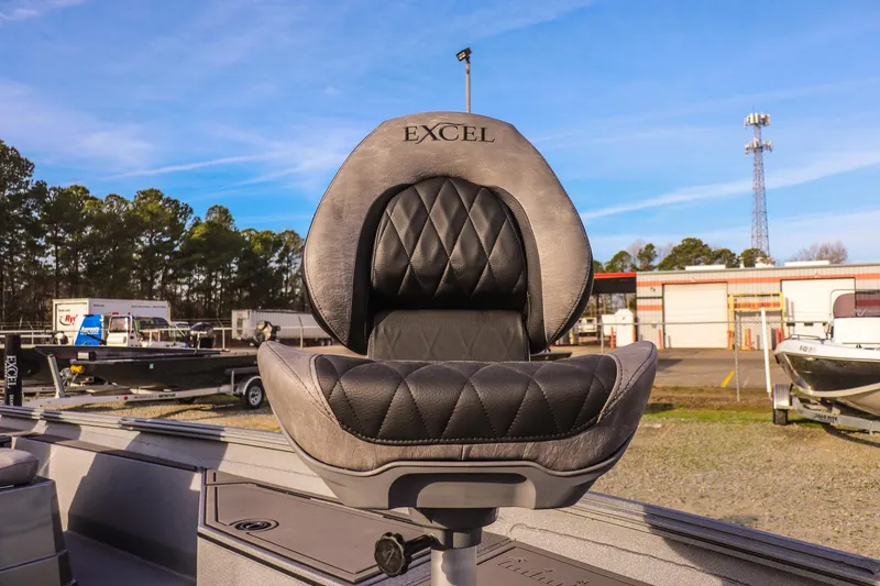 Slide: The Image of 2026 Excel 220 Bay Pro Elite boat seat with black and gray upholstery. - 26