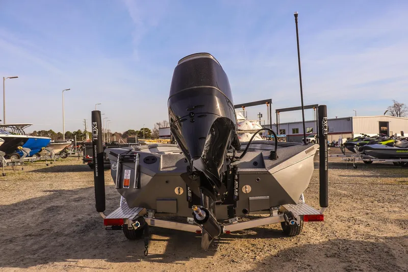Slide: The Image of 2026 Excel 220 Bay Pro Elite boat on trailer, rear view in outdoor setting. - 3