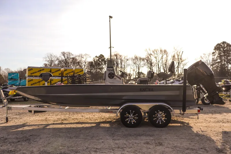 Slide: The Image of 2026 Excel 220 Bay Pro Elite boat on trailer, outdoor display. - 5