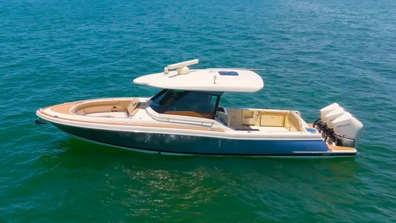 The Image of 2022 Chris-Craft Calypso 35 boat on open water, featuring sleek design and dual outboard engines. - 0
