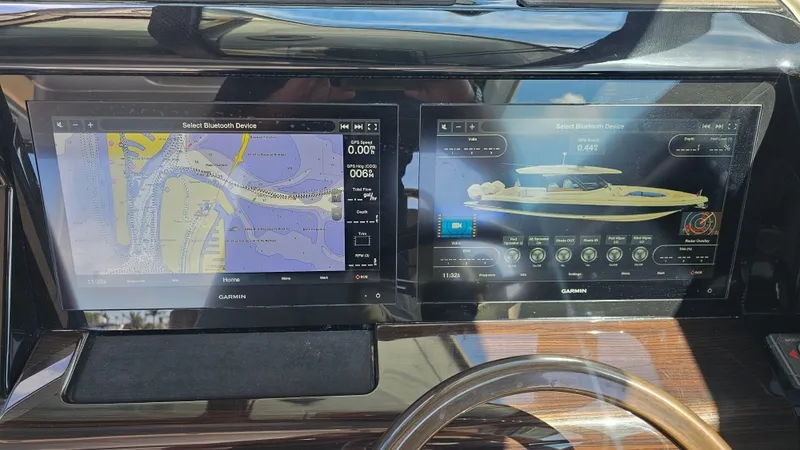 Slide: The Image of Dashboard of 2022 Chris-Craft Calypso 35 with Garmin navigation displays. - 15