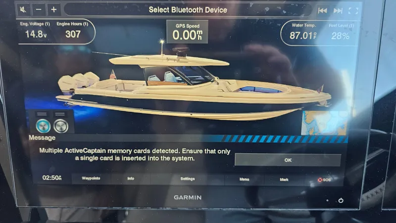 Slide: The Image of Display screen of 2022 Chris-Craft Calypso 35 boat with navigation and system alerts. - 16