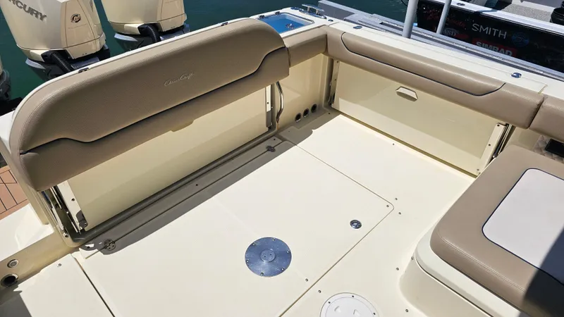 Slide: The Image of 2022 Chris-Craft Calypso 35 boat interior with beige seating and outboard motors. - 30