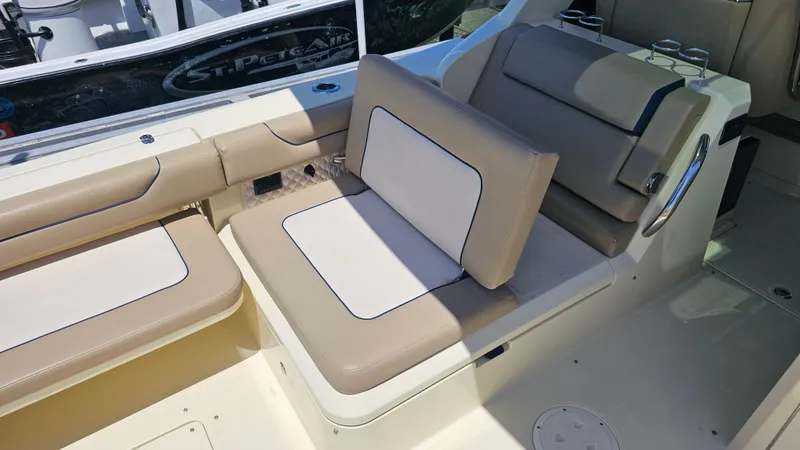 Slide: The Image of 2022 Chris-Craft Calypso 35 boat interior with beige and white seating. - 34