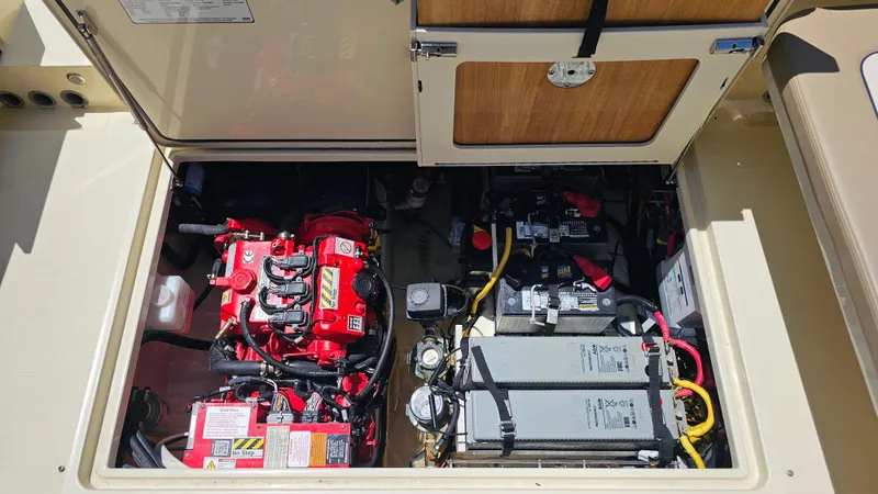 Slide: The Image of 2022 Chris-Craft Calypso 35 engine compartment with batteries and wiring. - 36