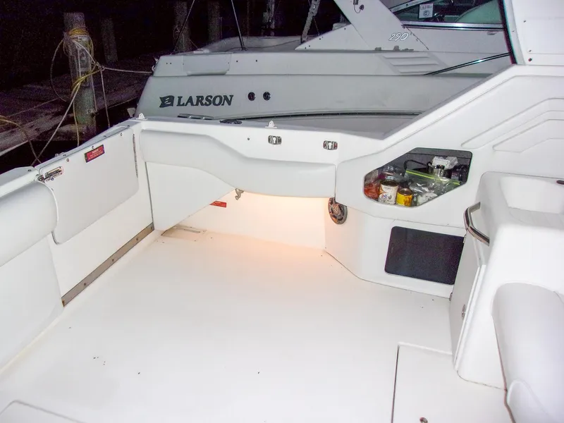 Slide: The Image of 1992 Sea Ray 400 Express Cruiser boat deck with storage compartments and lighting. - 12