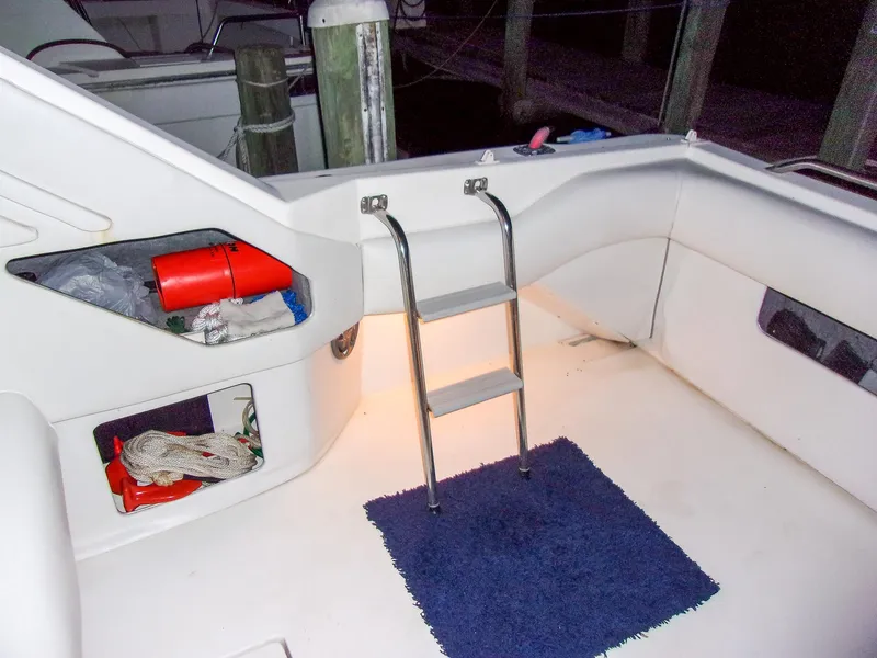 Slide: The Image of 1992 Sea Ray 400 Express Cruiser interior with ladder and storage compartments. - 13