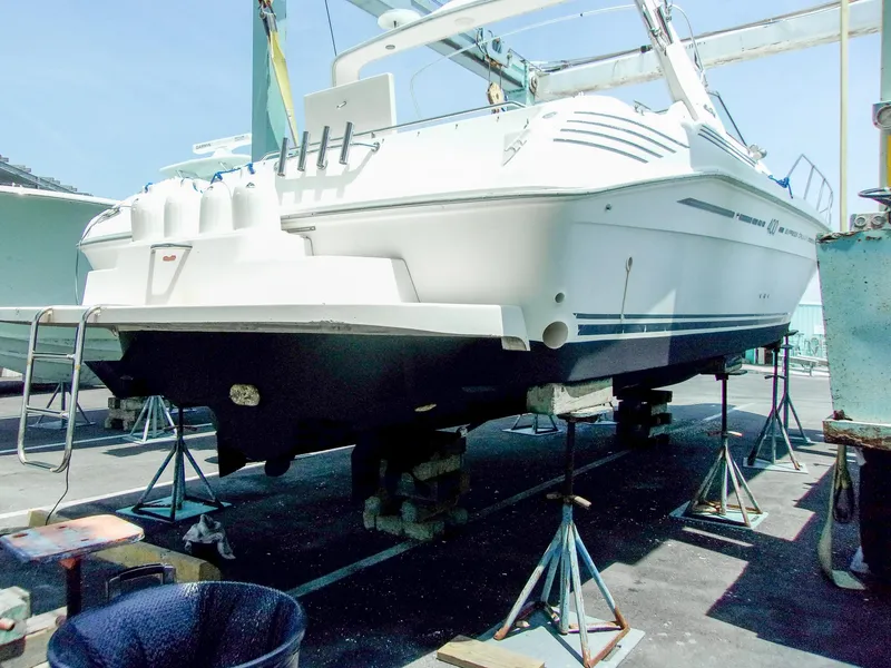 Slide: The Image of 1992 Sea Ray 400 Express Cruiser on dry dock for maintenance. - 24
