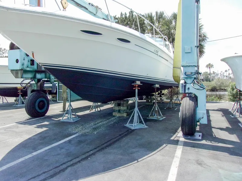 Slide: The Image of 1992 Sea Ray 400 Express Cruiser on dry dock, supported by stands. - 27