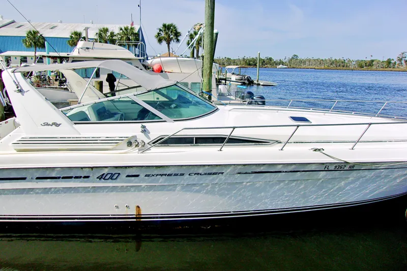 Slide: The Image of 1992 Sea Ray 400 Express Cruiser docked at marina. - 3