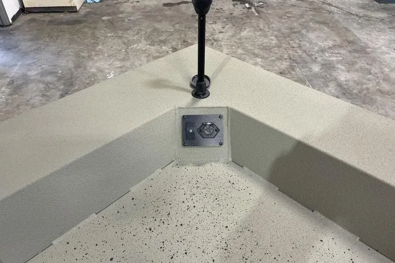 Slide: The Image of 2025 SeaArk Shadow 18T boat interior with textured flooring and mounted accessory. - 14