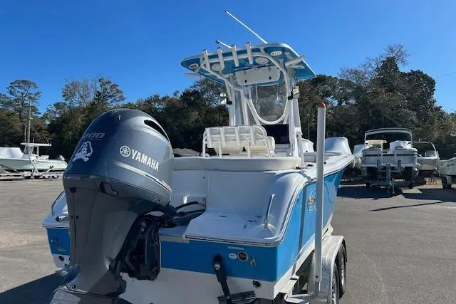 Slide: The Image of 2020 Sea Hunt Ultra 225 boat with Yamaha engine, parked outdoors. - 3