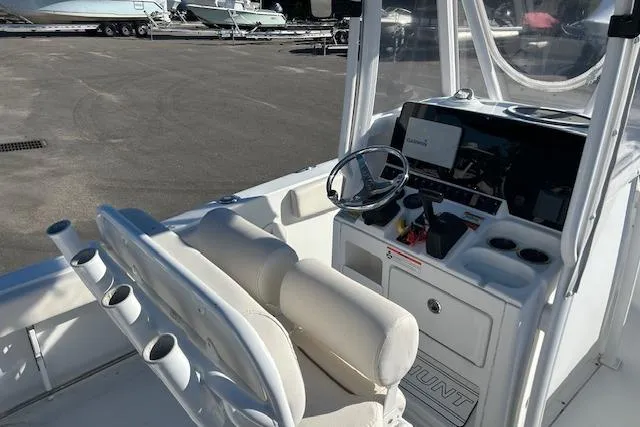 Slide: The Image of 2020 Sea Hunt Ultra 225 boat interior with steering console and seating. - 6
