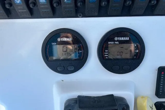 Slide: The Image of Yamaha gauges on 2020 Sea Hunt Ultra 225 boat dashboard, displaying tachometer and speed/fuel data. - 7