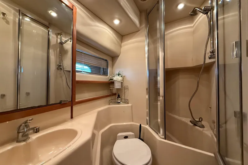 Slide: The Image of Luxurious bathroom in 2002 Bayliner 4788 Pilot House Motoryacht with shower and modern fixtures. - 23