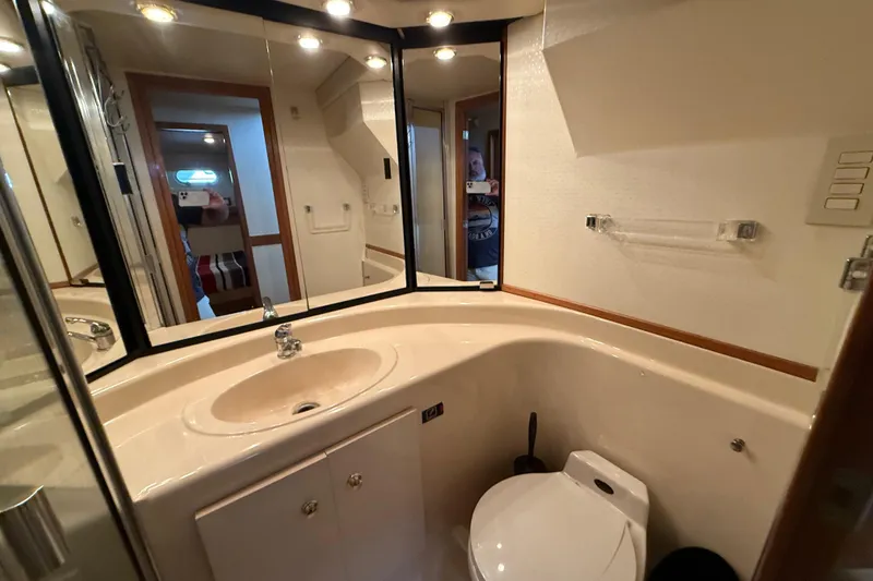 Slide: The Image of Luxurious bathroom in 2002 Bayliner 4788 Pilot House Motoryacht with modern fixtures and ample lighting. - 26