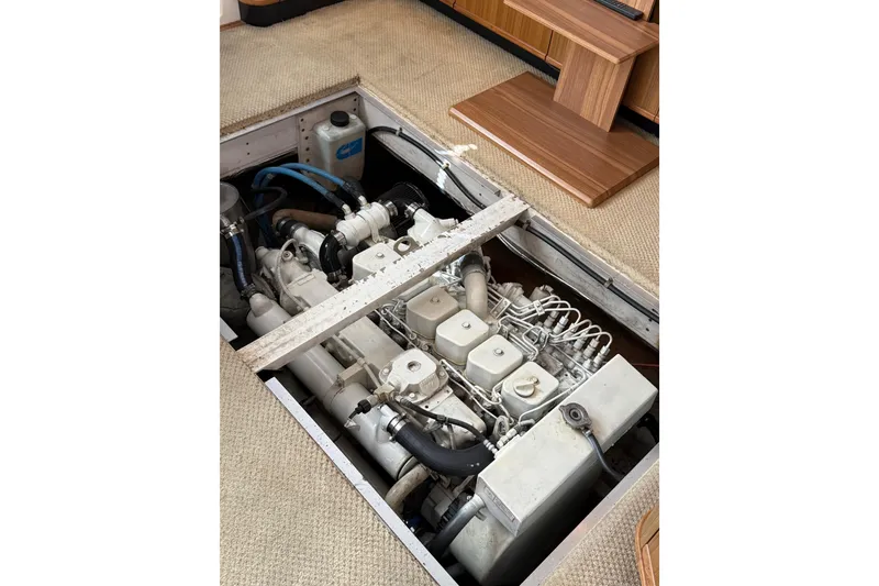 Slide: The Image of Engine compartment of 2002 Bayliner 4788 Pilot House Motoryacht, showcasing mechanical components. - 31