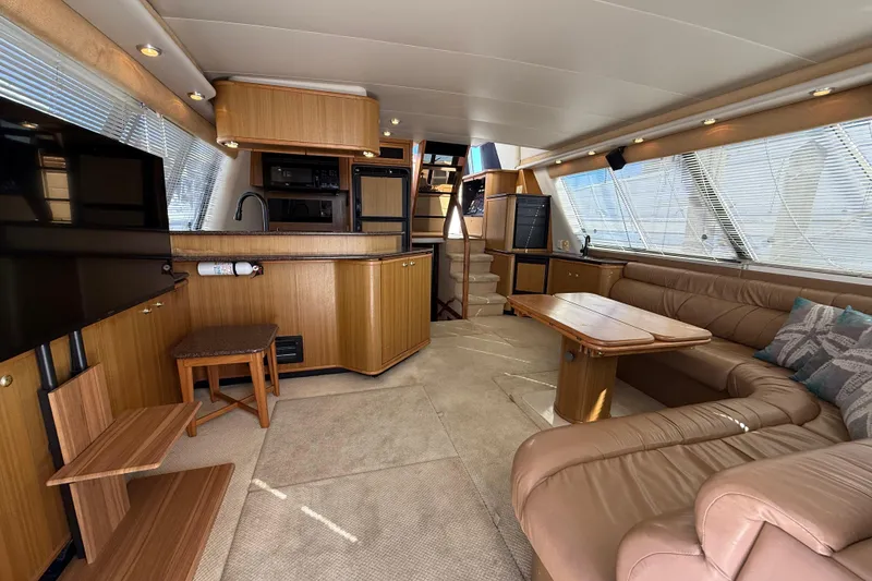 Slide: The Image of Luxurious interior of 2002 Bayliner 4788 Pilot House Motoryacht with leather seating and modern amenities. - 6