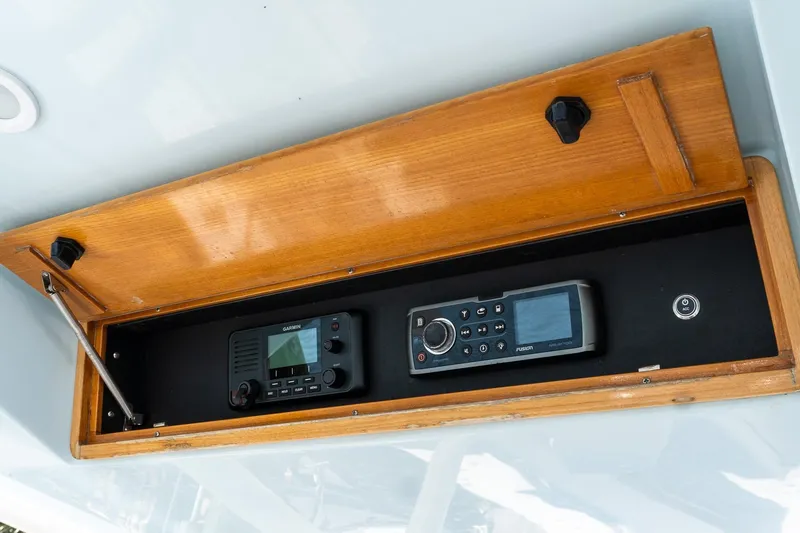 Slide: The Image of 2013 Jupiter 34 FS boat electronics panel with Garmin and Fusion devices. - 13