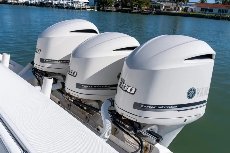 Slide: The Image of Triple Yamaha outboard engines on a 2013 Jupiter 34 FS boat. - 24