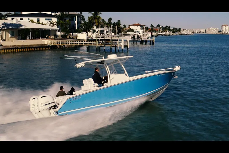 Slide: The Image of 2013 Jupiter 34 FS boat cruising on a sunny waterfront. - 3