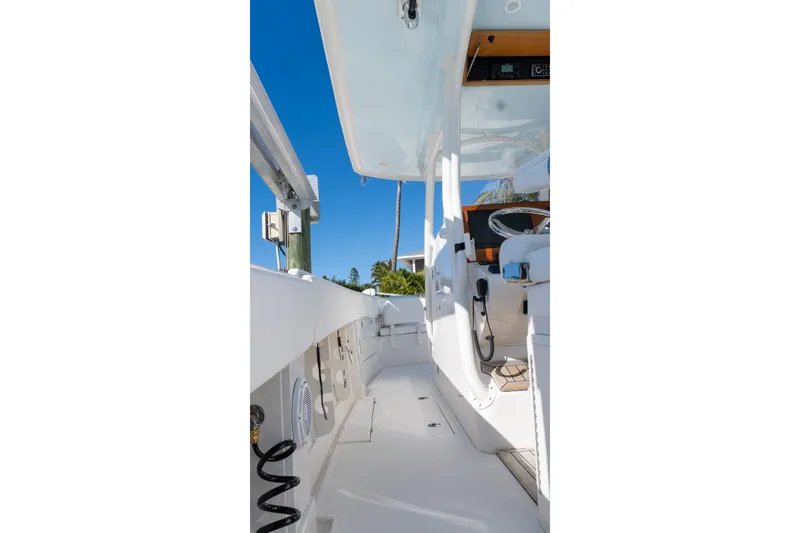 Slide: The Image of 2013 Jupiter 34 FS boat interior with white deck and clear blue sky. - 39