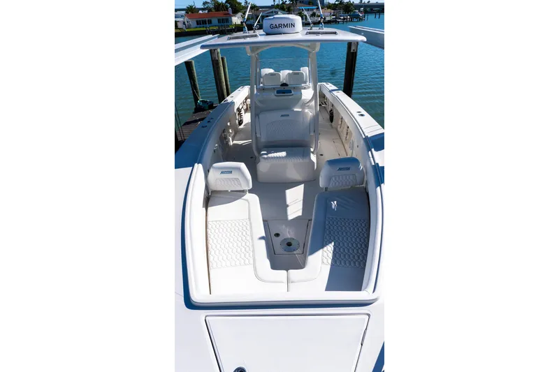 Slide: The Image of 2013 Jupiter 34 FS boat interior with seating, docked by the water. - 41