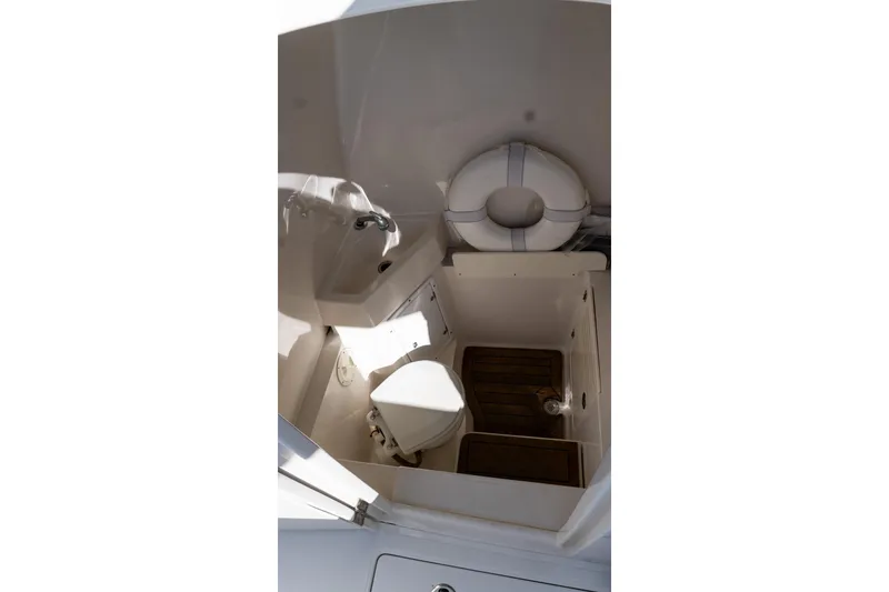 Slide: The Image of 2013 Jupiter 34 FS boat interior with toilet and life preserver. - 46