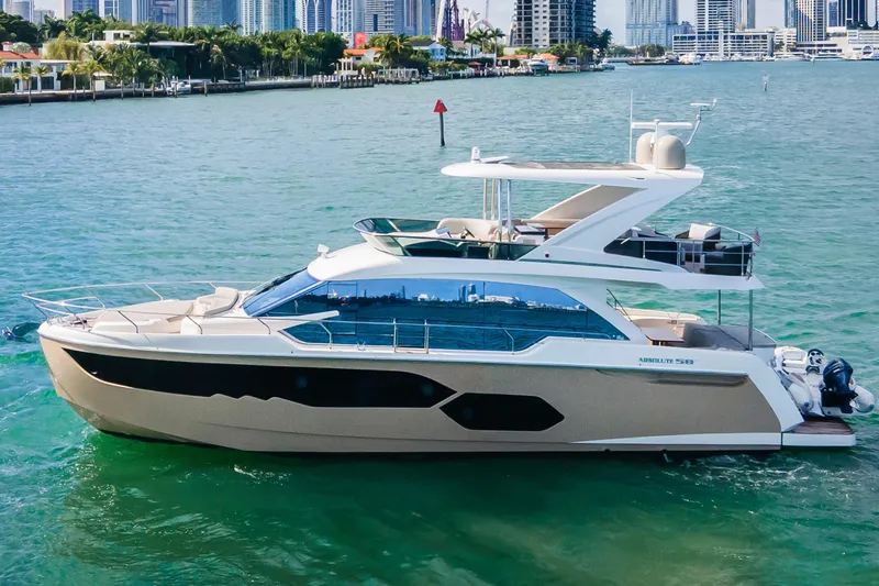 The Image of Luxury Absolute 58 FLY yacht on water near Miami skyline, 2019 model. - 0