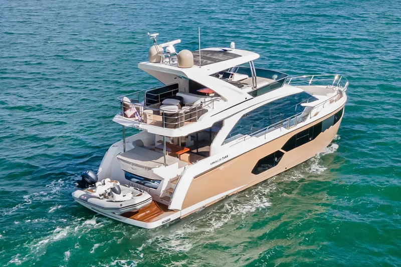 Slide: The Image of Luxurious 2019 Absolute 58 FLY yacht cruising in scenic waterfront cityscape. - 1