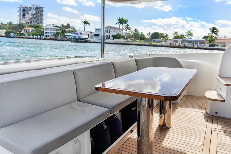 Slide: The Image of Luxurious seating area on 2019 Absolute 58 FLY yacht with waterfront view. - 10