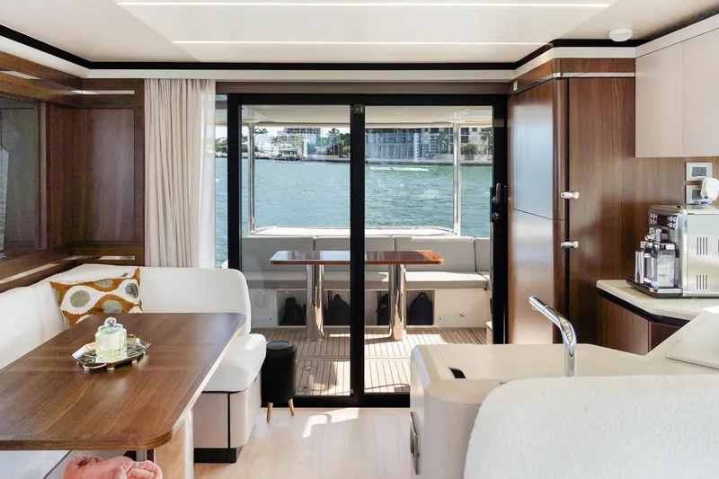 Slide: The Image of Luxurious interior of 2019 Absolute 58 FLY yacht with elegant dining area and scenic water view. - 13