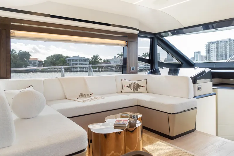 Slide: The Image of Luxurious interior of 2019 Absolute 58 FLY yacht with elegant white seating and scenic views. - 16