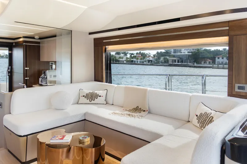 Slide: The Image of Luxurious interior of 2019 Absolute 58 FLY yacht with elegant seating and waterfront view. - 18