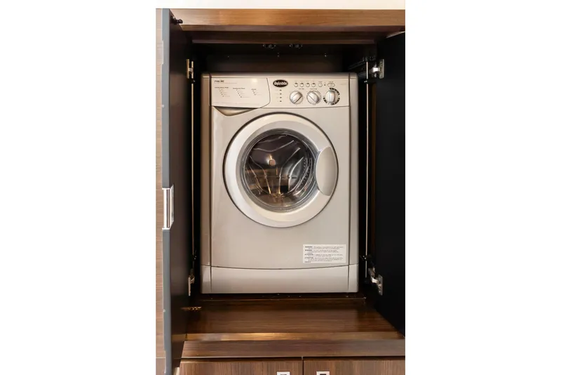 Slide: The Image of Front-loading washing machine in wooden cabinet on Absolute 58 FLY yacht, 2019 model. - 29
