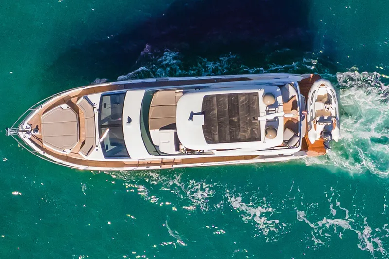 Slide: The Image of Aerial view of 2019 Absolute 58 FLY yacht cruising in clear turquoise waters. - 3