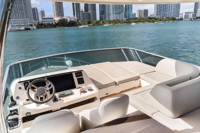 Slide: The Image of Luxurious 2019 Absolute 58 FLY yacht helm with city skyline view. - 35