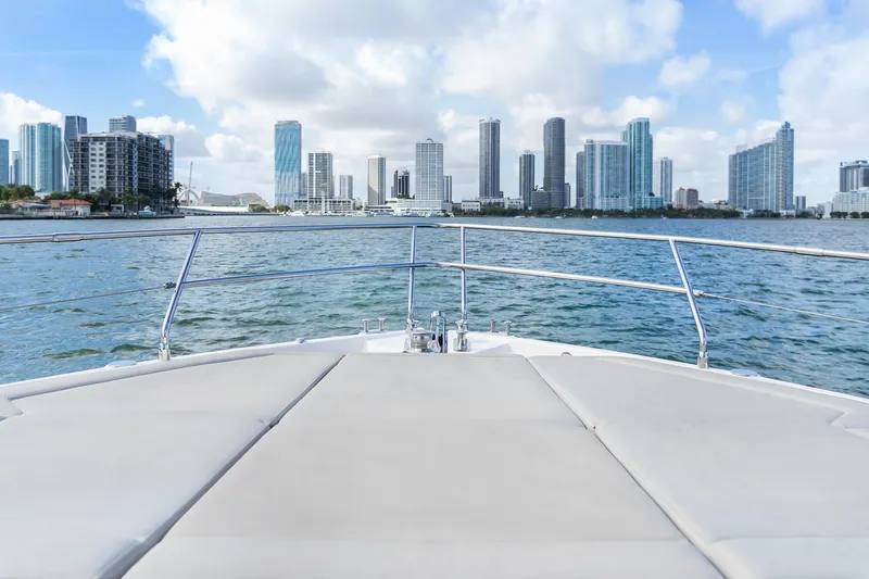 Slide: The Image of Luxury Absolute 58 FLY yacht, 2019 model, on open water under blue sky. - 39